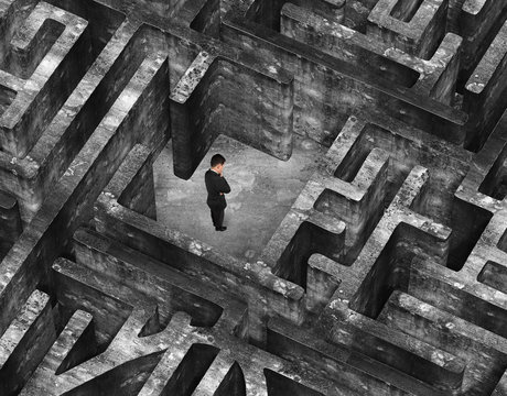 Businessman standing in center of 3D old mottled concrete maze