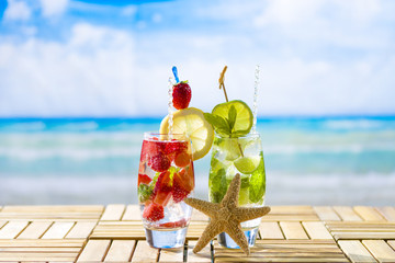 Fresh tropical cocktail on sunny beach