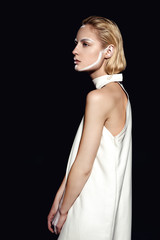 Fototapeta premium Blonde fashion woman in white coat pink sexy lips portrait