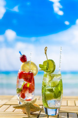 Fresh tropical cocktail on sunny beach