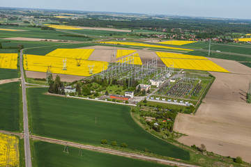 Aerial image of electrical substation featuring wires, transform