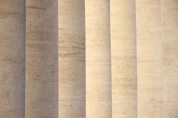 A line of Roman style columns along the corridor
