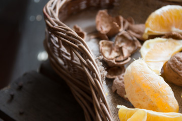 oranges and walnuts in a basket
