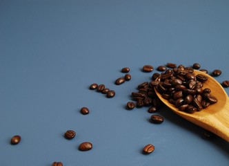 Wooden Scoop of Arabica Coffee Beans
