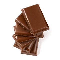 Stack of broken milk chocolate bars close up