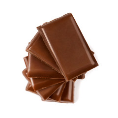 Stack of broken milk chocolate bars close up