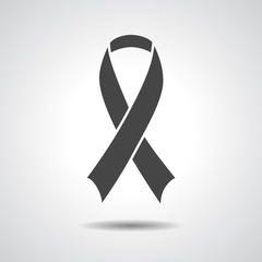 Black awareness ribbon on grey background