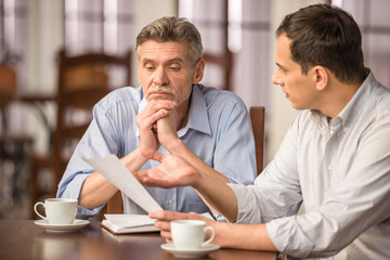 Businessmen in cafe