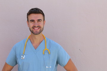 Male nurse in scrubs with stethoscope smiling