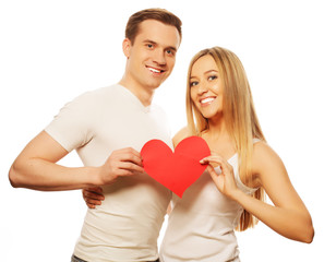 Happy couple in love holding red heart