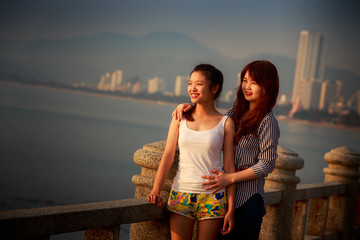 two vietnamese  brunette longhaired girls