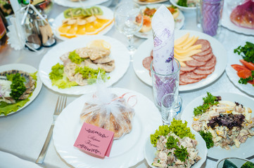 Festive well-laid Table with food and drink. 