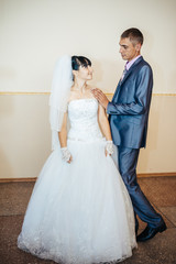 beautiful caucasian couple just married and dancing their first