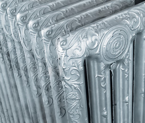 Close-up of a vintage decorated steel radiator