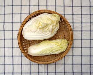 white cabbage on woven basket