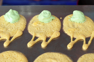 close up of thai crispy pancake - cream crepes
