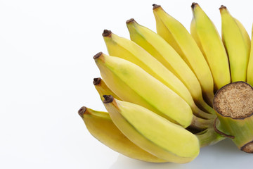 yellow banana in bunch and slice on wood