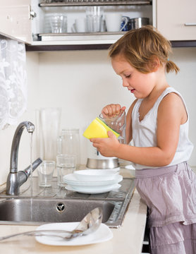 Baby Girl Washing Dishes