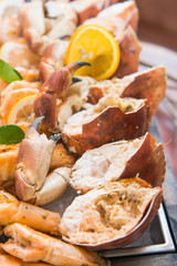 fresh crab on ice in buffet line seafood