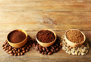 Various of coffee in small dishes on wooden background