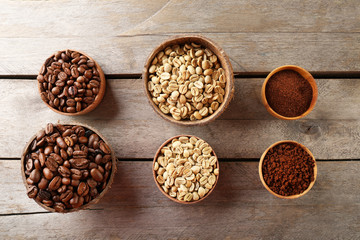 Various of coffee in small dishes on wooden table, top view