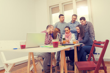 Young group of people discussing business plans.