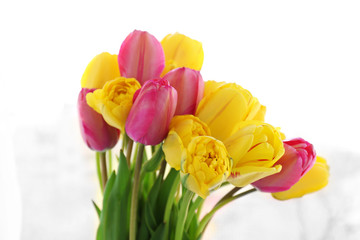 Beautiful bouquet of tulips on fabric background
