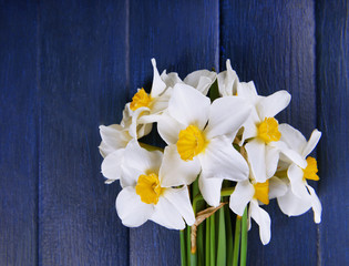 Beautiful bouquet of daffodils on wooden background