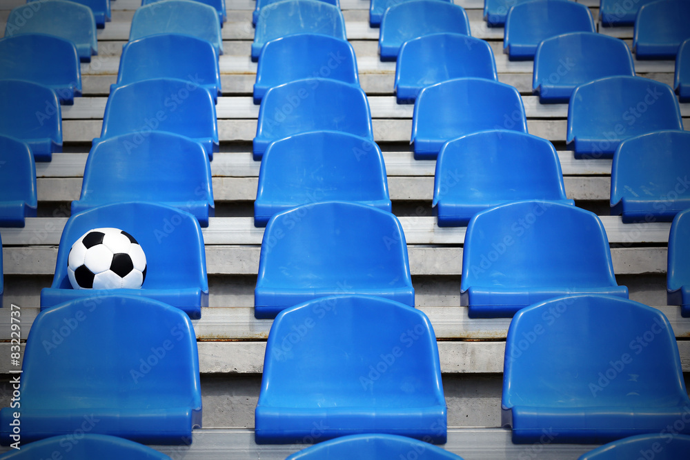 Poster Soccer ball on stadium seat