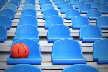 Basketball ball on stadium seat
