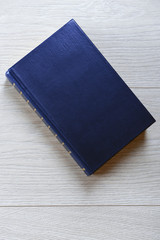 Old book on wooden background