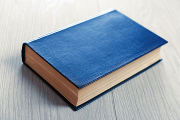 Old book on wooden background