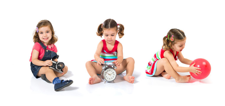 Kid holding a clock over white background