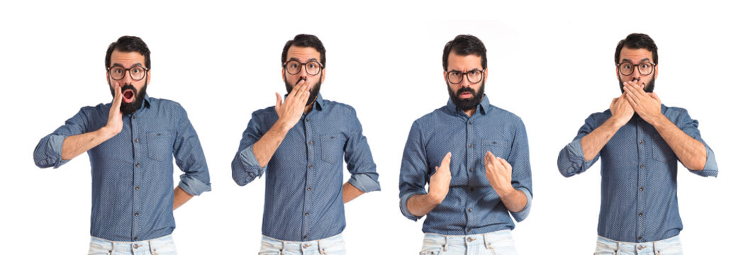 Young hipster man doing surprise gesture