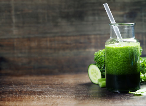 Fresh organic green smoothie - detox, diet and healthy food conc