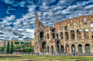 ROME - MAY 20, 2014: Tourists visit Colosseum. The city is visit