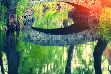 Stone bridge reflection in a lake