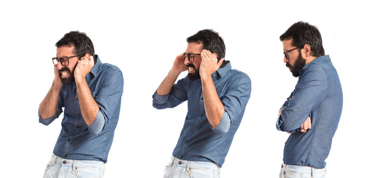 frustrated young hipster man over white background