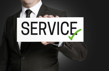 Service schild wird von Geschäftsmann  gehalten