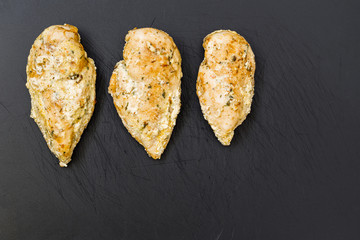 Chicken breast on cutting board.