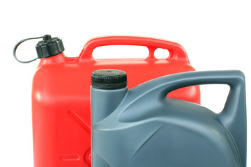 red and gray canisters of gasoline in isolated