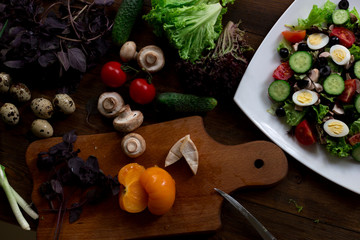 salad preparation quail eggs, mushrooms, brie, olives rustic