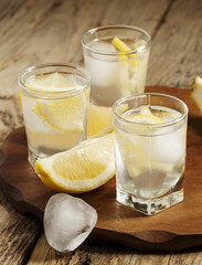 Refreshing cocktail with lemon and ice, selective focus