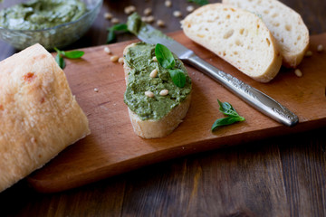 pesto preparation ingredients basil, garlic, lemon, pine, olives