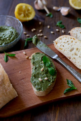 pesto preparation ingredients basil, garlic, lemon, pine, olives