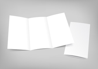 Blank white folding paper flyer on gray background.