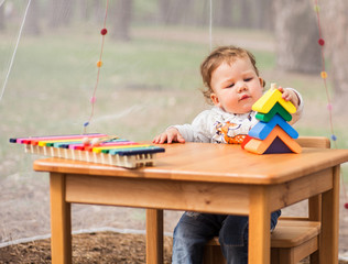 Little Girl with Toys, wooden xylophone