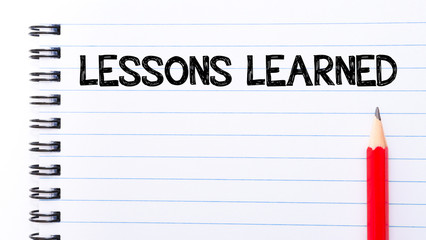 Lessons Learned Text written on notebook page - 83241160