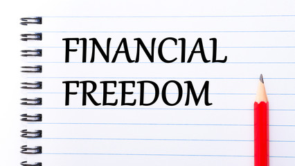 Financial Freedom Text written on notebook page