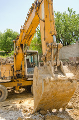 The excavator working on a construction site